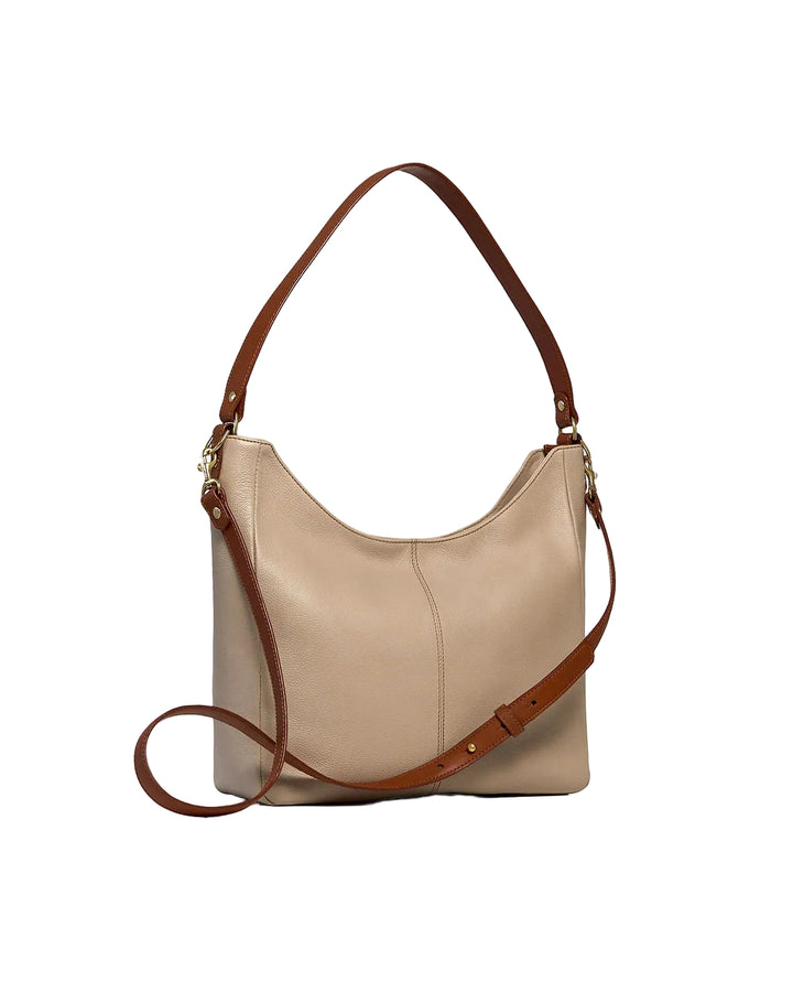 A beige leather hobo shoulder bag with a brown leather shoulder strap and a detachable brown crossbody strap, shown on a clean white background.